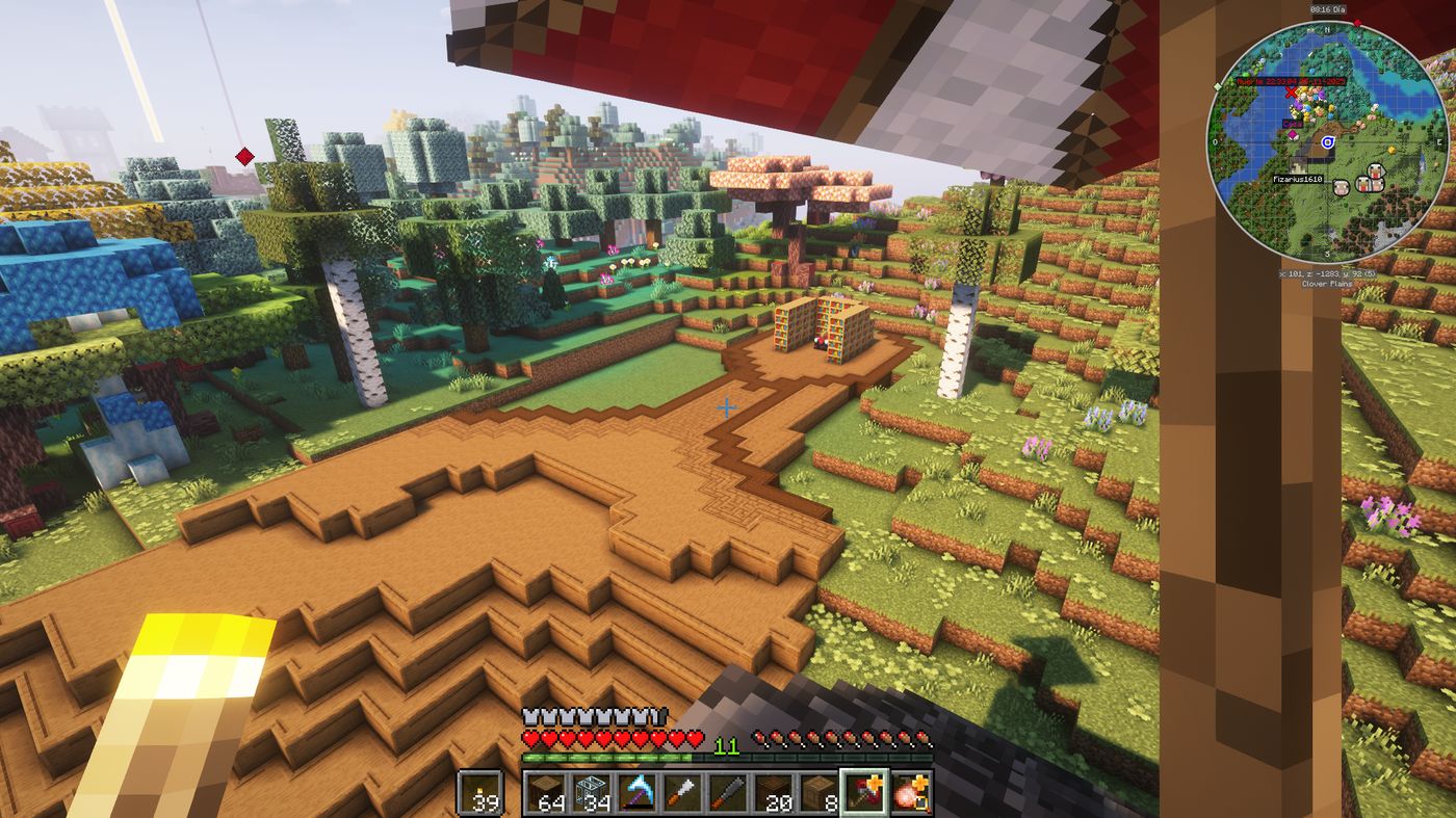 Piso de madera recién trazado marcando la forma de la futura casa en Minecraft